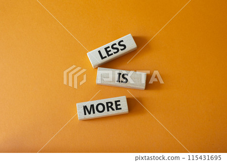 Less is More symbol. Concept words Less is More on wooden blocks. Beautiful orange background. Business and Less is More concept. Copy space. 115431695