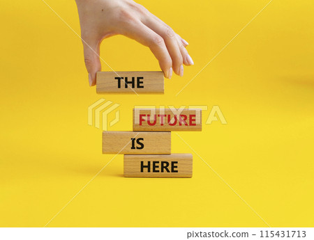 The future is here symbol. Concept words The future is here on wooden blocks. Beautiful yellow background. Businessman hand. Business and The future is here concept. Copy space. The future is here symbol. Concept words The future is here on wooden blocks. Beautiful yellow background. Businessman hand. Business and The future is here concept. Copy space. 115431713