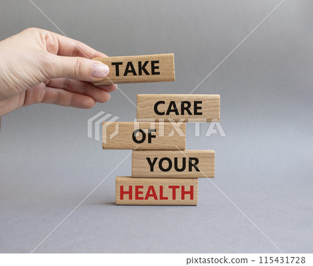 Health symbol. Wooden blocks with words Take Care of your Health. Doctor hand. Beautiful grey background. Health concept. Copy space. 115431728