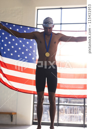 Proud young biracial male athlete swimmer displays a gold medal, with copy space Proud young biracial male athlete swimmer displays a gold medal, with copy space 115431953