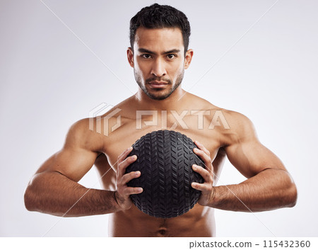 Portrait, athlete and serious man with medicine ball in studio for body care, wellness and health for muscles. Male person, bodybuilder and workout or training for weight loss by white background Portrait, athlete and serious man with medicine ball in studio for body care, wellness and health for muscles. Male person, bodybuilder and workout or training for weight loss by white background 115432360