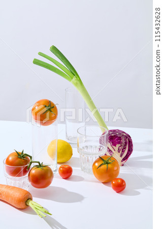 Vertical frame photo of high angle shot over light gray background, vegetable ingredients and glassware utensil in kitchen displayed on white countertop. Empty space for designing and advertising 115432628