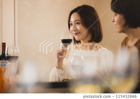 Women toasting with wine 115432666