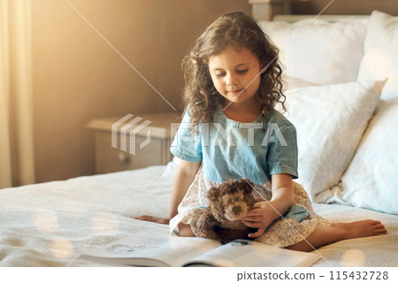 Story, book and child reading on bed at home with learning, storytelling and teddy bear in the morning. Development, education and youth fairytale with language and literature in bedroom with girl 115432728