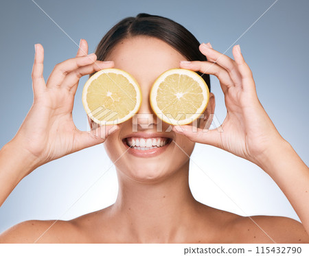 Happy woman, skincare and beauty with orange slices with fruit, vitamin c or natural in blue background. Female person, face and organic for cosmetic, pride or glow for dermatology in studio backdrop 115432790