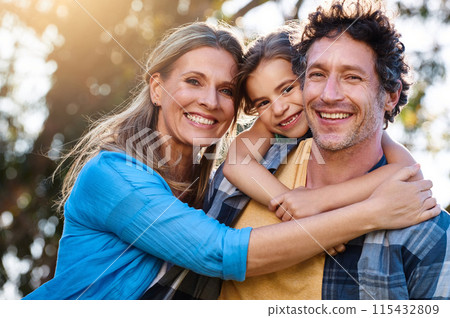 Family, portrait and piggyback hug for girl with parents in a park with love, games and fun bonding in nature. Support, freedom and people in a forest for back ride, travel and trust on vacation trip Family, portrait and piggyback hug for girl with parents in a park with love, games and fun bonding in nature. Support, freedom and people in a forest for back ride, travel and trust on vacation trip 115432809