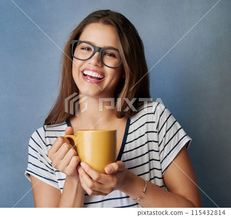 Woman, student and tea in studio with portrait, drink or glasses on blue background. Mockup, caffeine or energy or morning beverage for learner person, hand and matcha latte or coffee for hydration 115432814