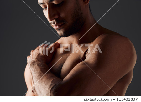 Fitness, shoulder or man in studio with thinking, close up or muscles on black background. Active person, bodybuilder or topless for workout with flex, athlete and healthy body or pride with progress 115432837