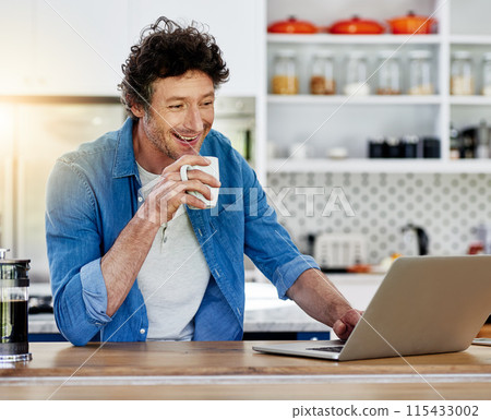 Man, home and happy on kitchen counter with laptop for remote work and online application for loan. Email, internet and smile with coffee for good news, approval and house finance or mortgage 115433002