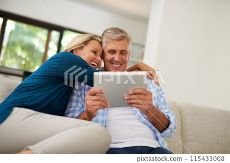 Couple, read and tablet on sofa for social media, laugh and meme online on couch. Technology, internet and app on digital website in home, man and woman person in lounge with touchscreen for comedy Couple, read and tablet on sofa for social media, laugh and meme online on couch. Technology, internet and app on digital website in home, man and woman person in lounge with touchscreen for comedy 115433008