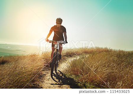 Morning, cycling and mountain bike with fitness, training and adventure on a dirt path. Bicycle, person and cardio of athlete with sport and exercise for race workout outdoor with cyclist journey Morning, cycling and mountain bike with fitness, training and adventure on a dirt path. Bicycle, person and cardio of athlete with sport and exercise for race workout outdoor with cyclist journey 115433025