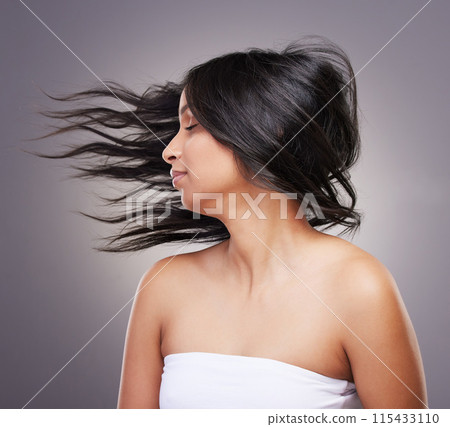 Beauty, hair flip and woman with healthy scalp for shine results, growth and salon grooming for care in studio. Texture, model girl and hairstyle motion with luxury spa aesthetic by grey background Beauty, hair flip and woman with healthy scalp for shine results, growth and salon grooming for care in studio. Texture, model girl and hairstyle motion with luxury spa aesthetic by grey background 115433110