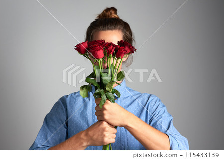 Hands, mockup or shy girl with bouquet of roses in studio for gift gesture for birthday, anniversary or celebration on grey background. Flower, cover or model behind floral present for valentines day Hands, mockup or shy girl with bouquet of roses in studio for gift gesture for birthday, anniversary or celebration on grey background. Flower, cover or model behind floral present for valentines day 115433139