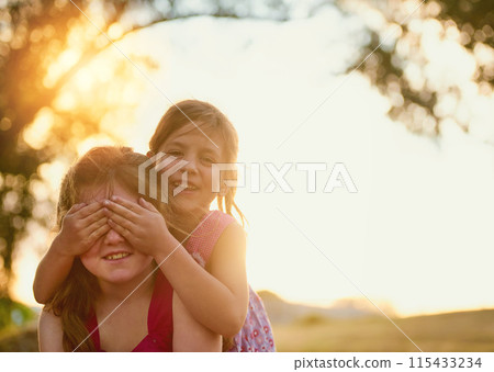 Children, happy and piggyback with cover eyes or sunshine in backyard playing, games and outdoor. Kids, siblings and together in nature for summer bonding activity for happiness, youth and friends 115433234