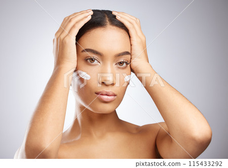Sunscreen, cream and portrait of woman for skincare and dermatology in studio background. Calm, girl and model relax with lotion moisturizer on face for healthy glow or natural beauty and cosmetics Sunscreen, cream and portrait of woman for skincare and dermatology in studio background. Calm, girl and model relax with lotion moisturizer on face for healthy glow or natural beauty and cosmetics 115433292