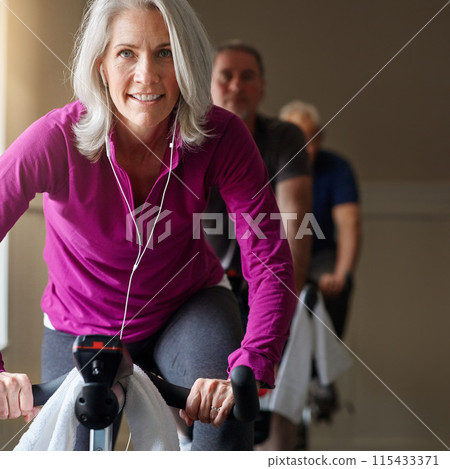 Senior, portrait or happy woman in spinning class in workout or training for cycling bike, health or wellness. Proud, exercise or elderly sports person on gym bicycle for fitness, challenge or energy 115433371