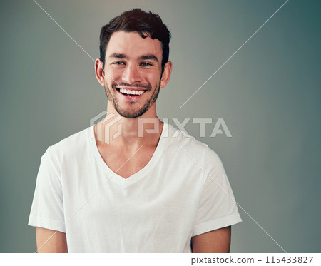 Happy, man and portrait with confidence in studio for good mood, satisfaction and funny joke. Relax, male person and face with laughing for humor, comedy meme and confidence on gray background 115433827
