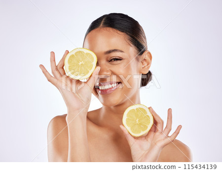 Skincare, portrait and woman with lemon in studio for natural, beauty and facial treatment. Cosmetic, health and female person with citrus fruit for vitamin c dermatology routine by white background. 115434139