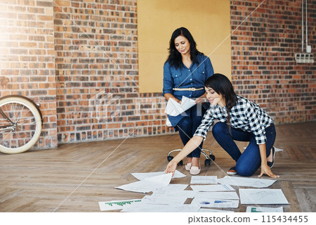 Business woman, collaboration and team with documents in meeting, planning or brainstorming infrastructure at office. Group of creative employees with paperwork for startup, project or tasks on floor 115434455