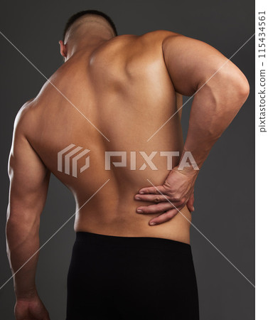 Back pain, body and fitness man in studio with workout mistake, fail or muscle inflammation on black background. Sports, injury and male bodybuilder with backache, wound or anatomy risk and emergency Back pain, body and fitness man in studio with workout mistake, fail or muscle inflammation on black background. Sports, injury and male bodybuilder with backache, wound or anatomy risk and emergency 115434561