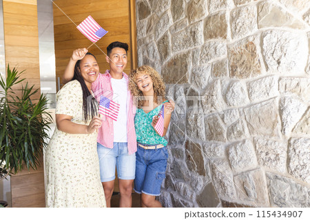 Diverse friends celebrate with American flags, with copy space Diverse friends celebrate with American flags, with copy space 115434907