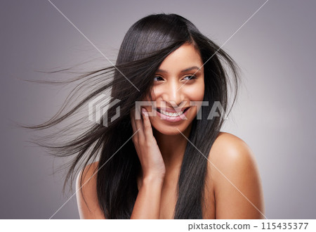 Hair care, thinking and woman in studio with wind for keratin treatment, shampoo or beauty cosmetics on gray background. Salon, body and hand of model for satisfaction, growth or collagen shine Hair care, thinking and woman in studio with wind for keratin treatment, shampoo or beauty cosmetics on gray background. Salon, body and hand of model for satisfaction, growth or collagen shine 115435377