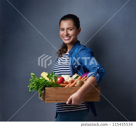 Studio, farmer or girl in portrait with vegetables, nutrition and fresh products in basket by mockup. Small business, organic or harvest with female supplier, agriculture and food by gray background 115435534
