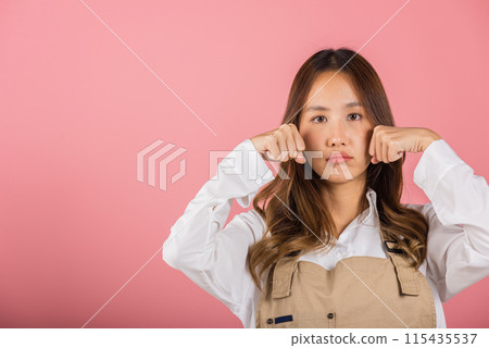 Unhappy small business woman bad mood her cry wipe tears with fingers, Asian beautiful young female stress feeling sad unhappy crying, studio shot isolated on pink background with copy space Unhappy small business woman bad mood her cry wipe tears with fingers, Asian beautiful young female stress feeling sad unhappy crying, studio shot isolated on pink background with copy space 115435537