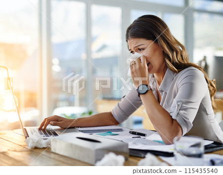 Woman, tissue and sick by laptop in office with runny nose, allergy and virus infection on desk. Business, health problem and female worker for cold, fever and flu symptoms in workplace for covid 19 Woman, tissue and sick by laptop in office with runny nose, allergy and virus infection on desk. Business, health problem and female worker for cold, fever and flu symptoms in workplace for covid 19 115435540