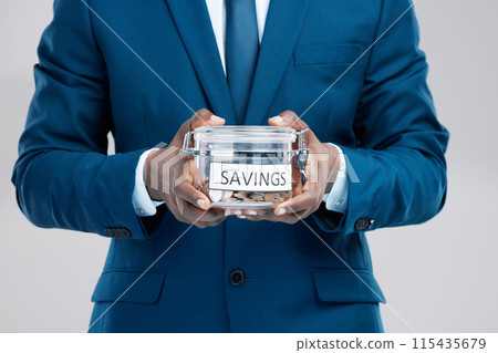 Hands, black man and jar with savings for money, cash investment and budget management by studio background. African guy, businessman and container with coins for financial security and pension fund 115435679