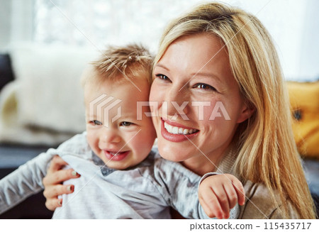 Baby, mother and smile in house with hug or happiness for motherhood, growth or wellness of child. Toddler, woman and excited in home for care, support and bonding together with love, mom and relax 115435717