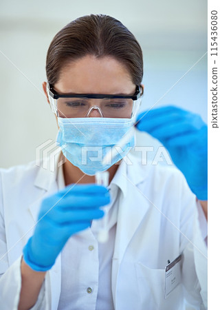 Woman, scientist and test tube for scientific or research, reaction and experiment. Healthcare, mask and chemical vial with medial study or innovation for vaccine, cure and treatment or medicine Woman, scientist and test tube for scientific or research, reaction and experiment. Healthcare, mask and chemical vial with medial study or innovation for vaccine, cure and treatment or medicine 115436080