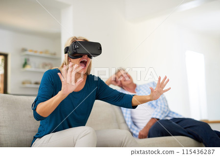 Couple, home and people with vr for games on sofa for online video challenge and fun. Metaverse experience, futuristic and technology on couch for gaming, contest and competition or hobby and excited Couple, home and people with vr for games on sofa for online video challenge and fun. Metaverse experience, futuristic and technology on couch for gaming, contest and competition or hobby and excited 115436287