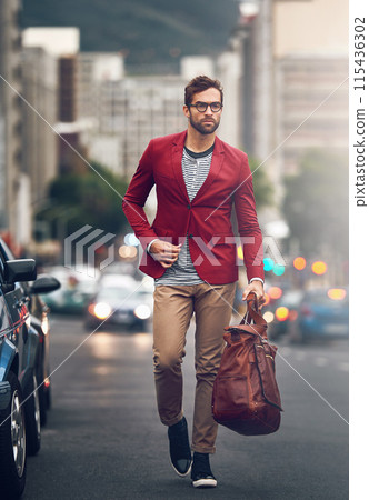 Stylish businessman, walking and city with bag for fashion or work gear, smart casual with glasses. Male accountant, urban and luggage with funky clothes for commute, cool and wellness in New York 115436302