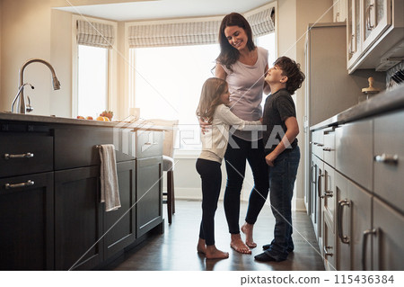 Mother, children and hug in kitchen for conversation, love and support for relationship in home. Mommy, kids and together in embrace for talking or security, speaking and bonding in family house Mother, children and hug in kitchen for conversation, love and support for relationship in home. Mommy, kids and together in embrace for talking or security, speaking and bonding in family house 115436384