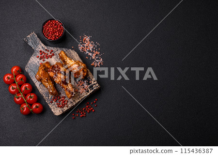 Delicious crispy grilled wings with teriyaki sauce with salt, spices 115436387
