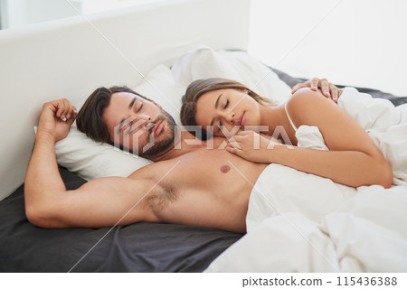 Couple, cuddle or sleep embrace in bed for morning romance, love and bonding on weekend. Relationship, man and woman laying together in home for comfort, relax or care and resting with partner 115436388