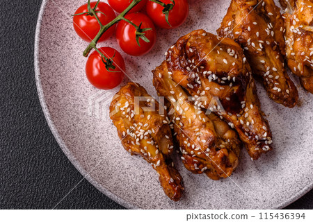 Delicious crispy grilled wings with teriyaki sauce with salt, spices 115436394