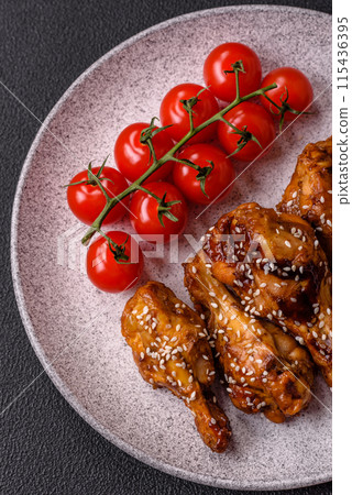 Delicious crispy grilled wings with teriyaki sauce with salt, spices Delicious crispy grilled wings with teriyaki sauce with salt, spices 115436395