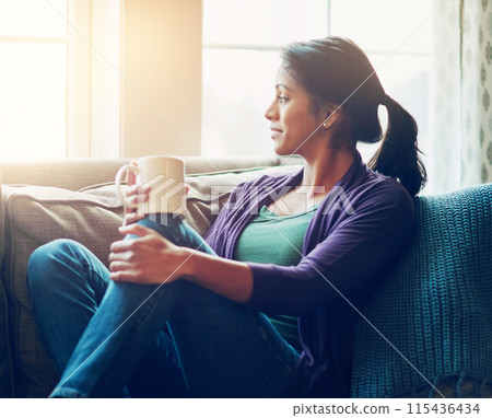 Thinking, drinking coffee and Indian woman in house living room for morning breakfast, vision or remember. Tea, dream and person on sofa for peace, calm and planning future decision in home to rest 115436434