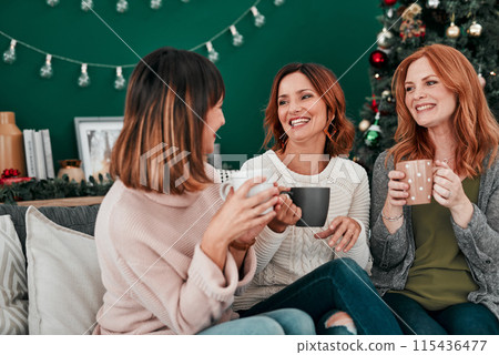 Coffee, friends and women on sofa for Christmas celebration and talking together for vacation reunion. Female people, group and smile with hot chocolate drink for happy conversation and festive decor Coffee, friends and women on sofa for Christmas celebration and talking together for vacation reunion. Female people, group and smile with hot chocolate drink for happy conversation and festive decor 115436477