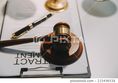 Lawyer, legal advisor, businessman brainstorming information on agreement details Business contracts in legal processing books for accuracy in contract documents. joint financial investment. 115436538