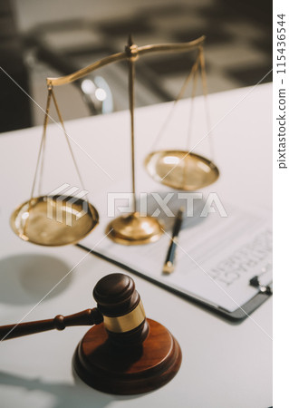Lawyer, legal advisor, businessman brainstorming information on agreement details Business contracts in legal processing books for accuracy in contract documents. joint financial investment. 115436544