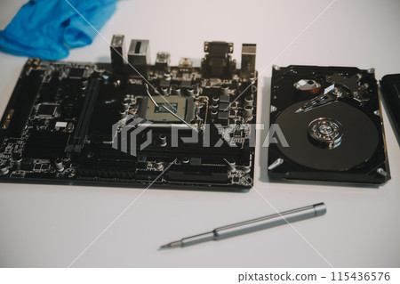 Close up of Technician measuring voltage electronic circuit board television, Service after sale fix electric equipment within insurance. Close up of Technician measuring voltage electronic circuit board television, Service after sale fix electric equipment within insurance. 115436576
