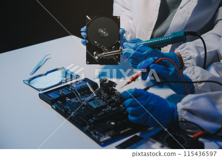 Close up of Technician measuring voltage electronic circuit board television, Service after sale fix electric equipment within insurance. Close up of Technician measuring voltage electronic circuit board television, Service after sale fix electric equipment within insurance. 115436597