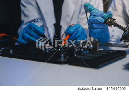 Close up of Technician measuring voltage electronic circuit board television, Service after sale fix electric equipment within insurance. Close up of Technician measuring voltage electronic circuit board television, Service after sale fix electric equipment within insurance. 115436602
