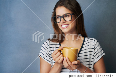 Woman, student and coffee in studio with thinking, drink or glasses on blue background. Mockup, caffeine or energy or health for learner person, hands and matcha or green tea for hydration and relax 115436617
