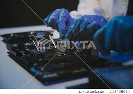 Close up of Technician measuring voltage electronic circuit board television, Service after sale fix electric equipment within insurance. Close up of Technician measuring voltage electronic circuit board television, Service after sale fix electric equipment within insurance. 115436624