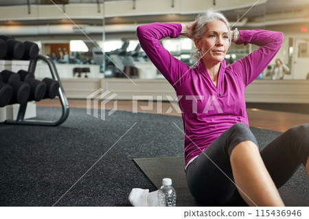 Gym, stomach workout and woman with fitness, sport and abs exercise for wellness and health. Training, athlete and thinking with crunches, abdomen muscle and core strength on the floor and ground Gym, stomach workout and woman with fitness, sport and abs exercise for wellness and health. Training, athlete and thinking with crunches, abdomen muscle and core strength on the floor and ground 115436946