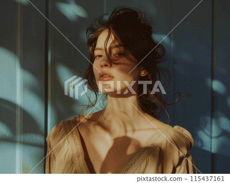 Portrait of woman with tousled hair in soft natural light, creating cinematic and moody atmosphere 115437161